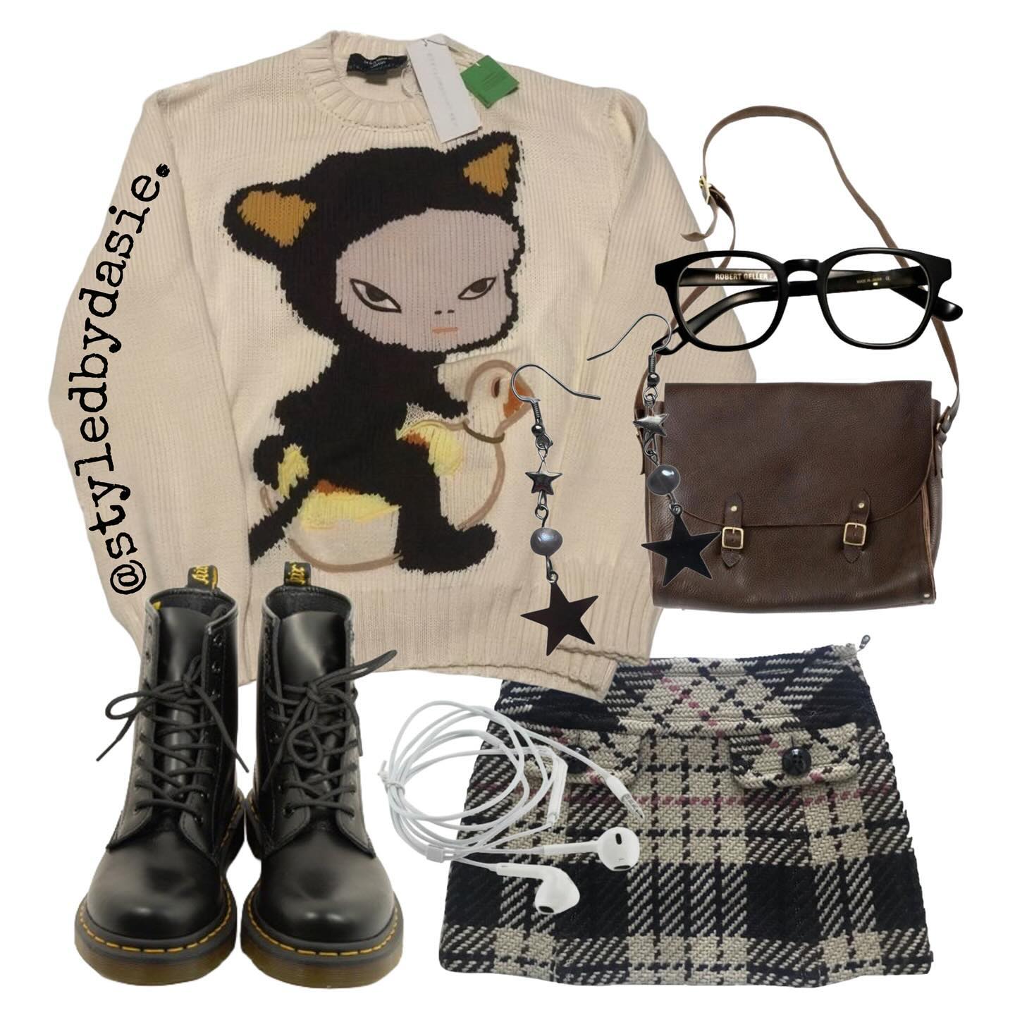 A Graphic Cream Sweater with a Plaid Skirt for Cozy Preppy Style